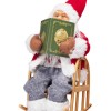 Kalėdinė dekoracija Senelis ant kėdės su LED, 25 cm, 3 spalvos